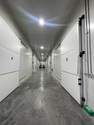 Modern cold storage corridor with insulated walls and temperature monitoring